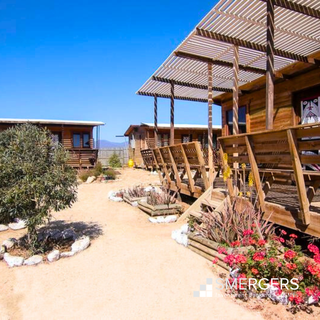 For Sale: Tourist accommodation complex with 8 cabins, main house on 5,000 sqm land, trees.