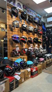 Bangshal-based motorcycle retail shop with 50 daily walk-ins, specializing in helmets and spares.